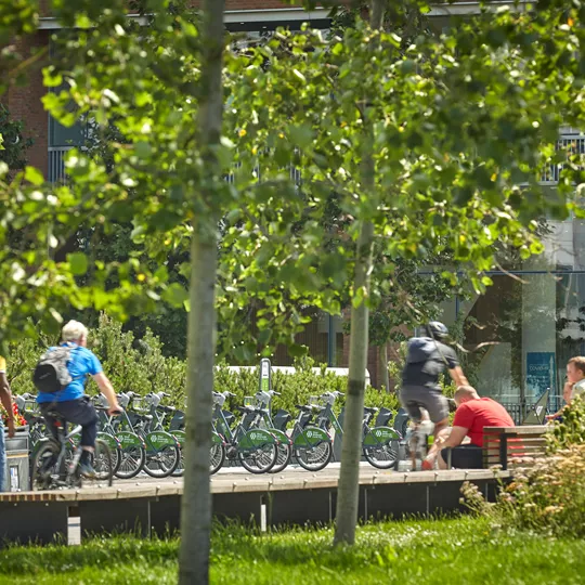 Men biking through Coventry